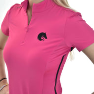 A person wearing a Hobby Horse LarDen T-Shirt LarDen Pink, made of bright pink Spandex with short sleeves, a black horse head logo on the chest, partially zipped at the collar, and their light-colored hair is visible.