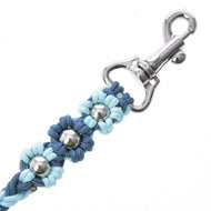 A close-up of the Hobby Horse LarDen Lead Rope Bloom Blue, featuring blue braided material with metal flower-shaped decorations and a shiny silver clasp—ideal for quality hobby horse equipment.