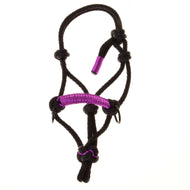 The Rope Halter Violette by Hobby Horse LarDen features a black design with purple accents and knots, making it a stylish accessory for horses. Shown against a white background.