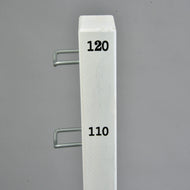The Hobby Horse LarDen Jump 120 cm / 47 inch with Extra Poles is a white vertical post with black numbers 110 and 120, two metal hooks on the left side, ideal for adjustable indoor or outdoor hobby horsing, shown against a plain gray background.